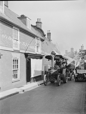 OLD STREET WITH STEAM ENGINE AND CARS